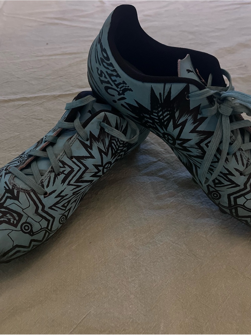 Puma Light Blue Athletic Shoes with Black Graphic Design